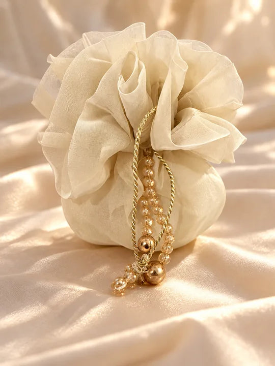 Ivory organza potli bag with gold cord and beads