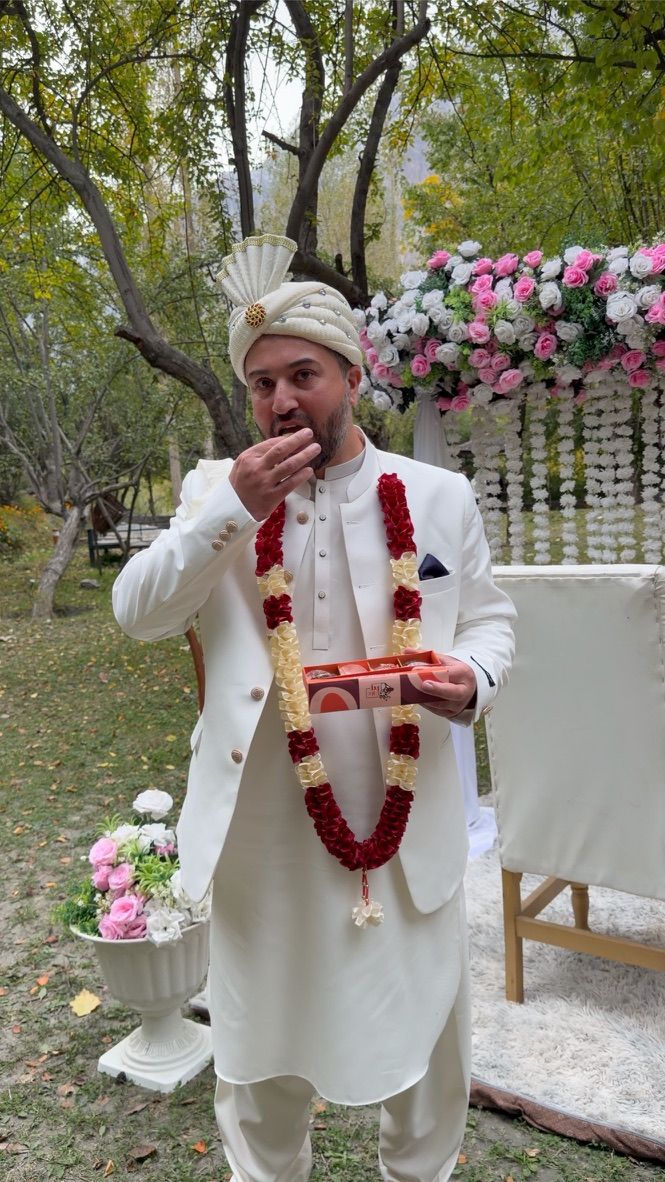 Groom eating a Date Pop date at his nikkah