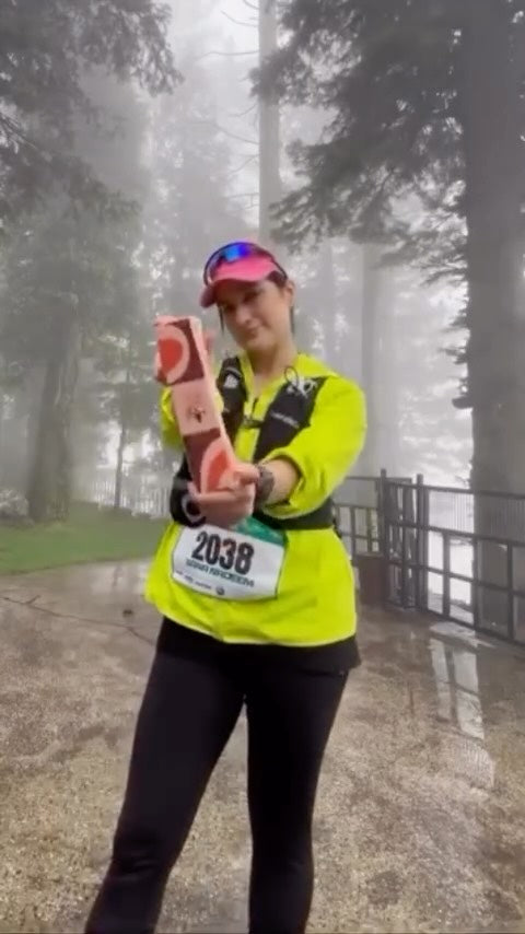 Runner with a Date Pop box at a marathon