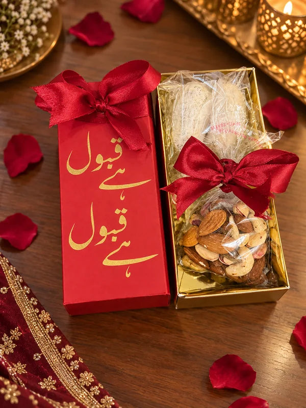 Red Qabool Hai bid box with coconut dates and a bag of mixed dry fruit