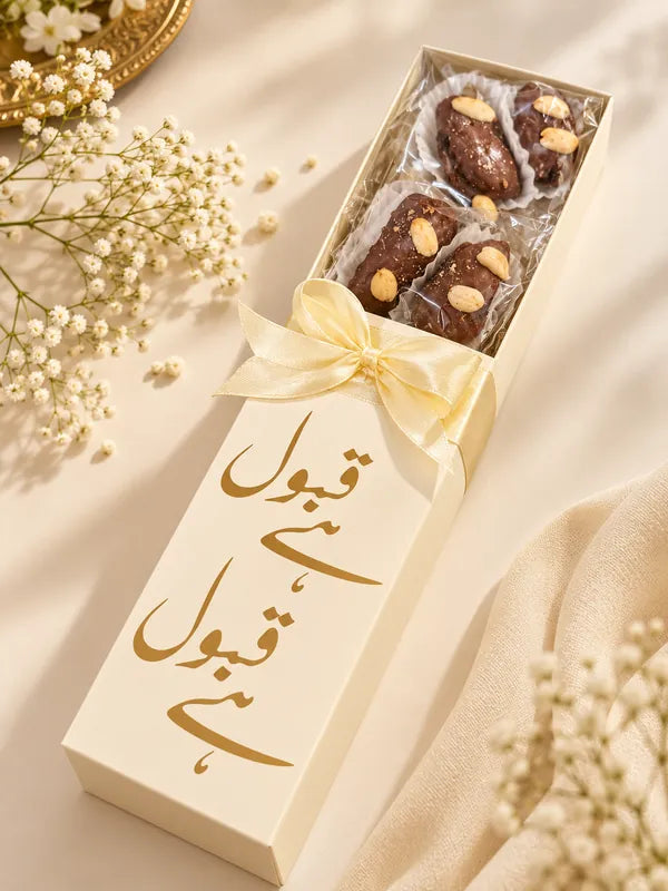 Ivory Qabool Hai bid box with gold calligraphy and chocolate dates